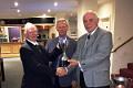 Captain Tony Hodgson presents Geordie Mawson with the May Fu Two Trophy, with Chairman Alan Brewer